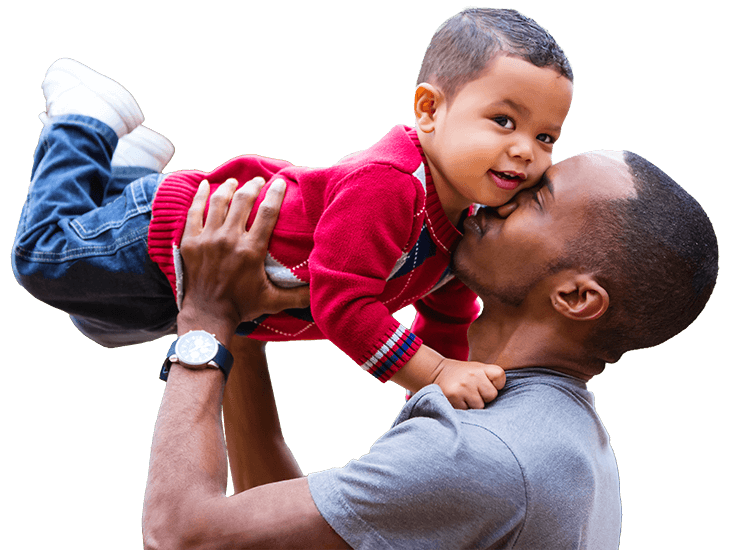 Adult holding child up in his arms