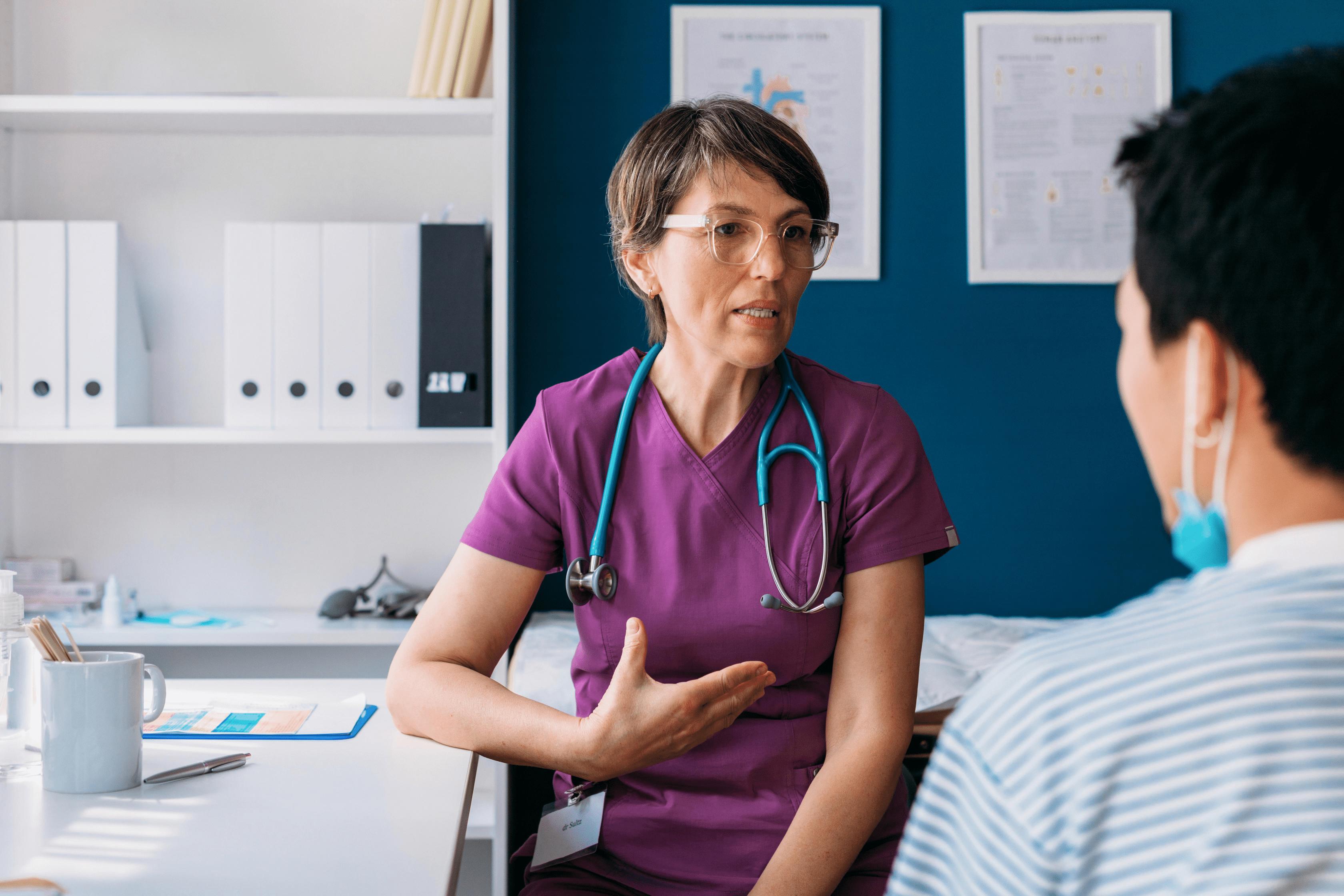 nurse speaking with patient