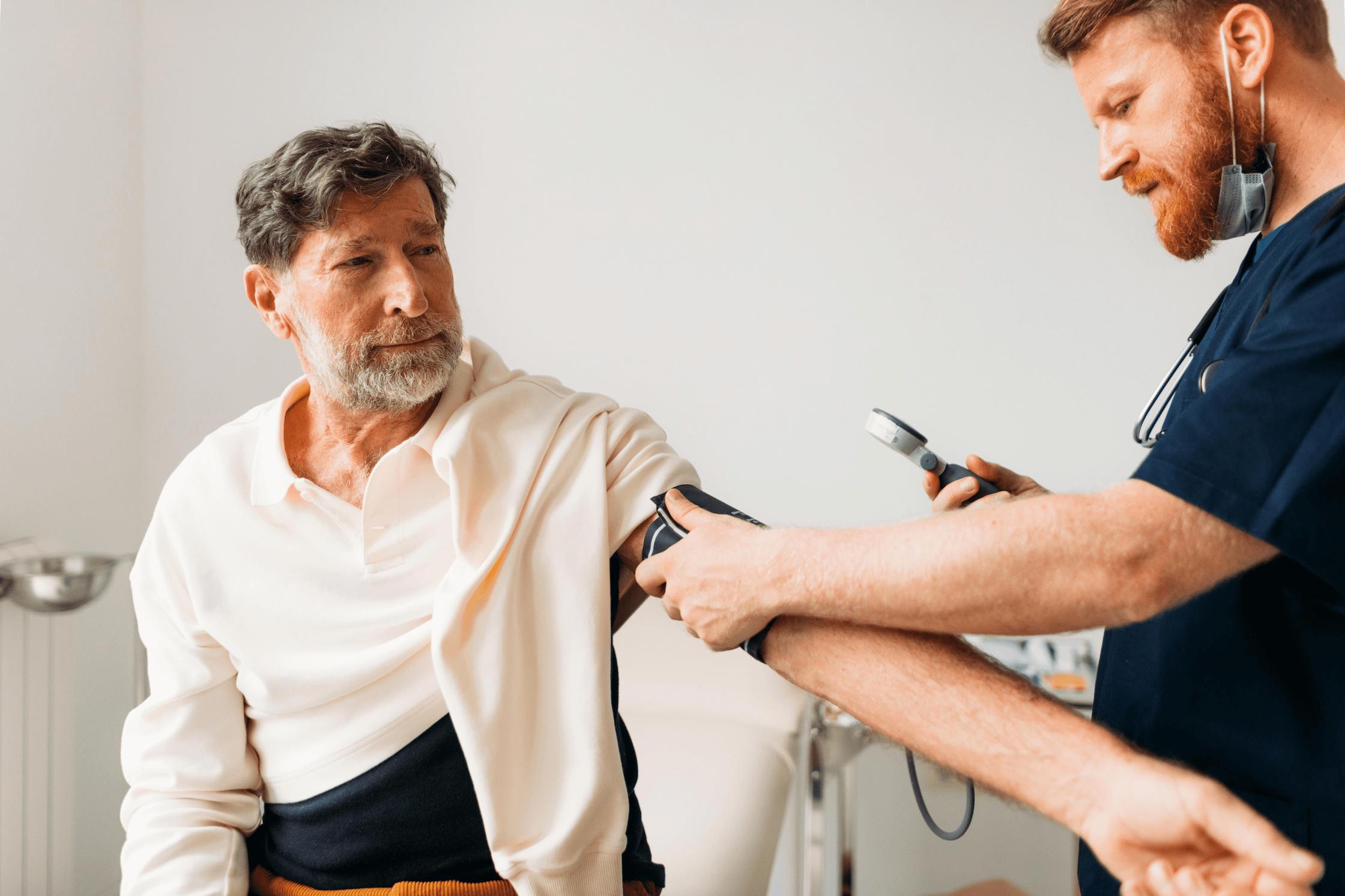 nurse taking blood pressure reading