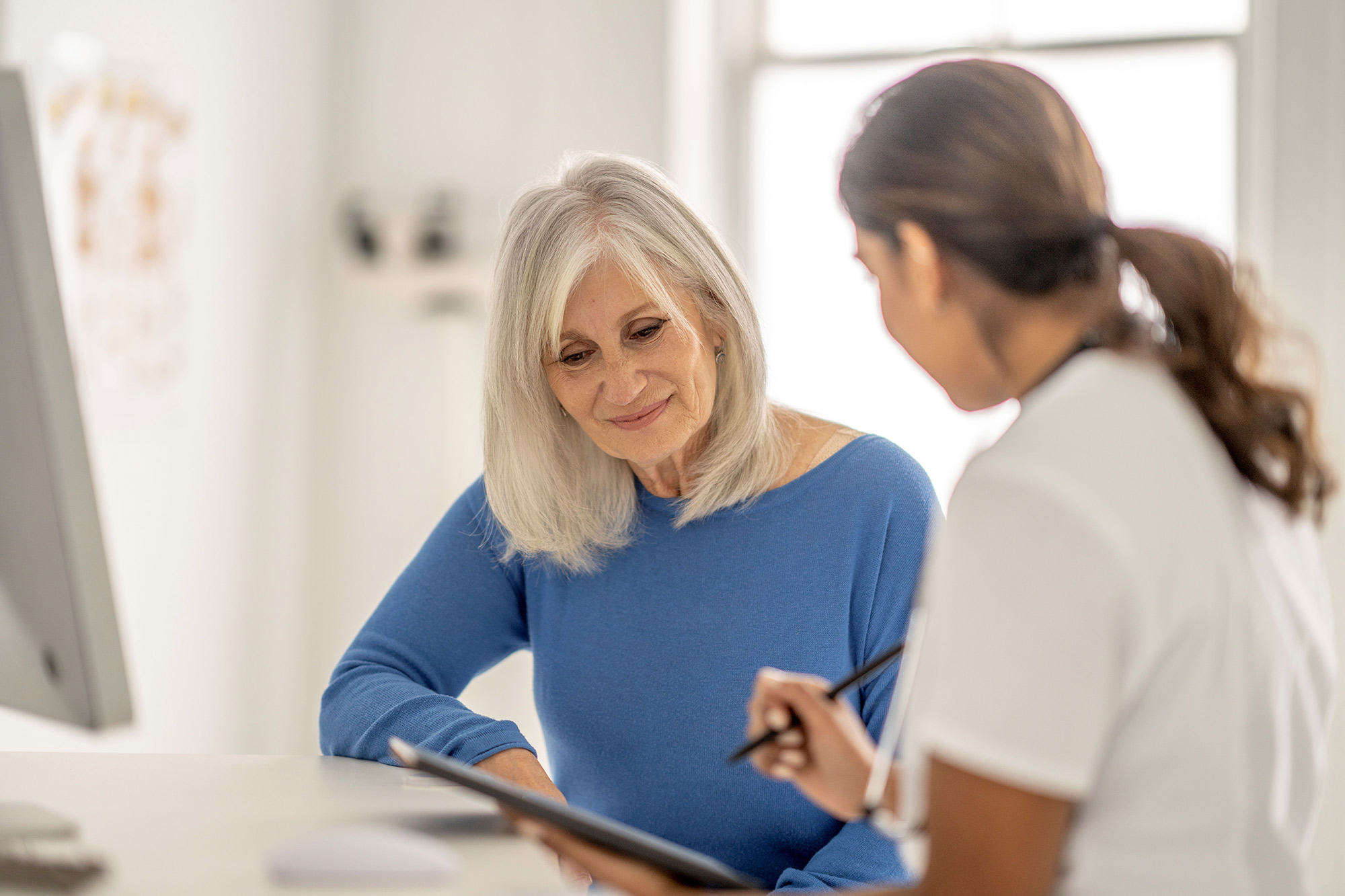 doctor-explaining-to-elderly-patient Doctor explaining to elderly patient