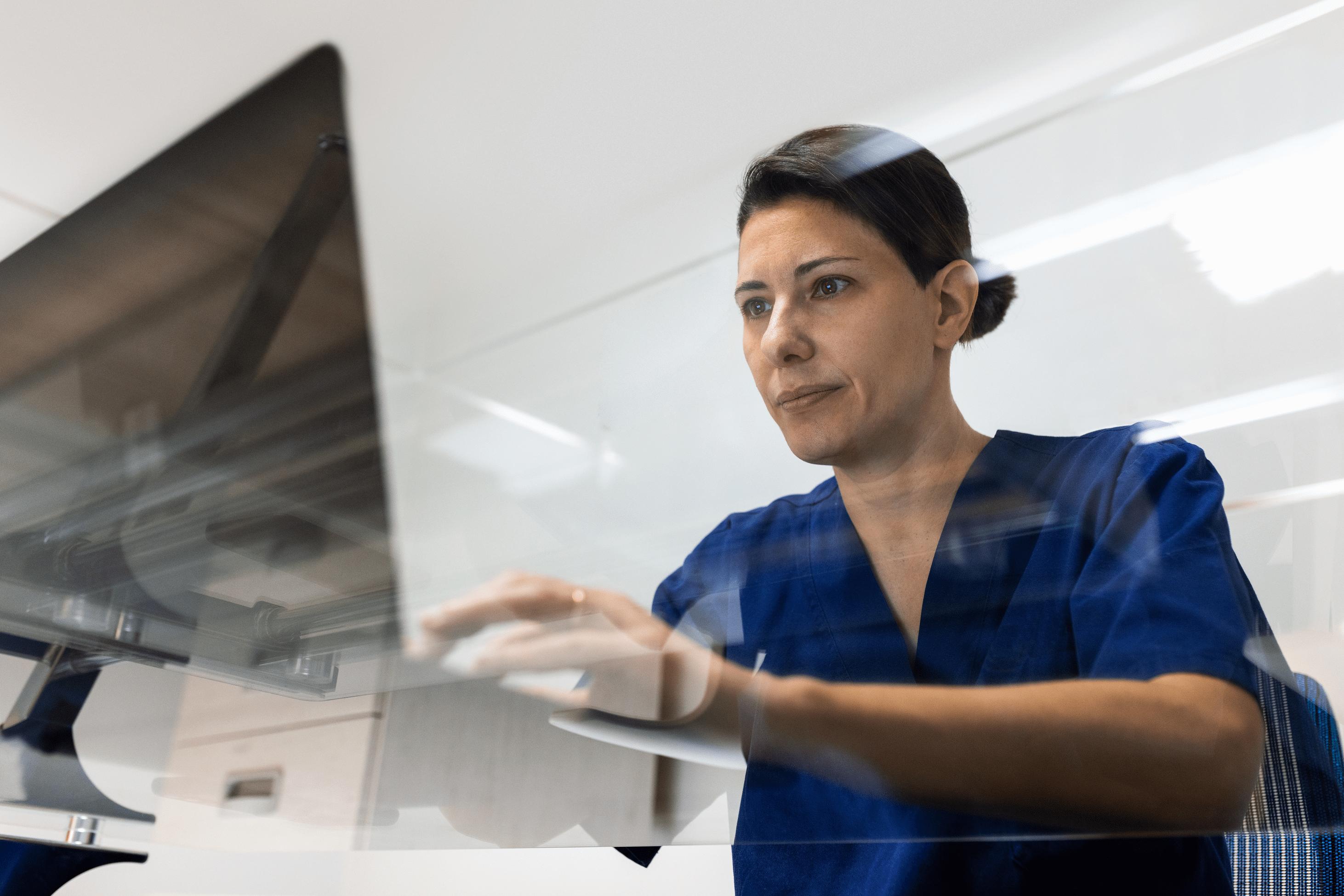 female provider typing on laptop