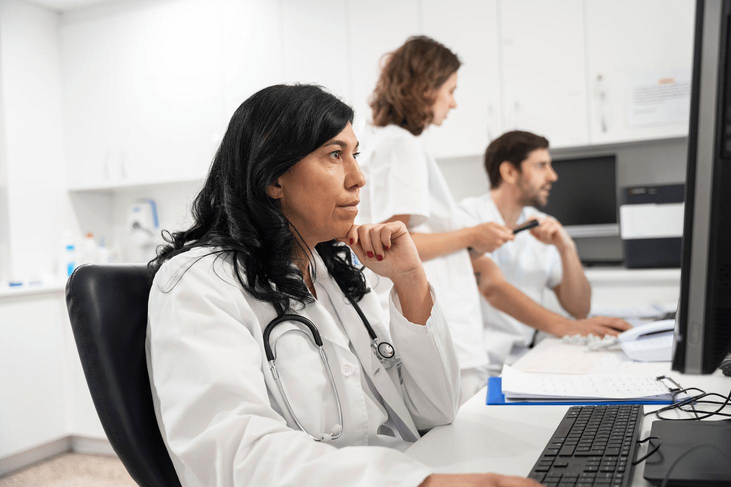 doctor reviewing information on computer